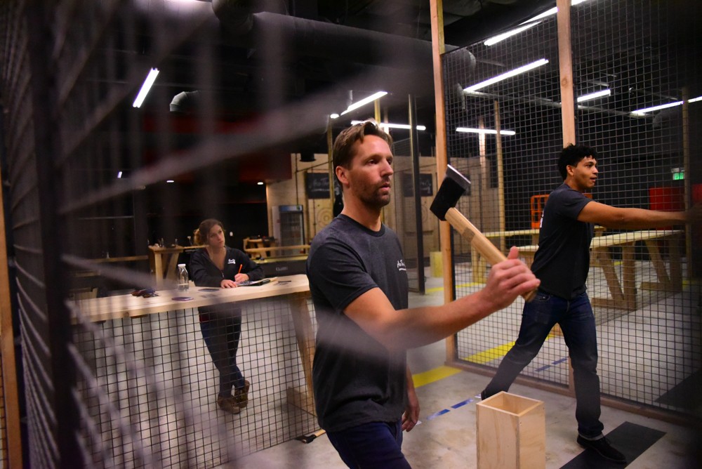 Guest preparing to throw an axe at Axe Thro Co